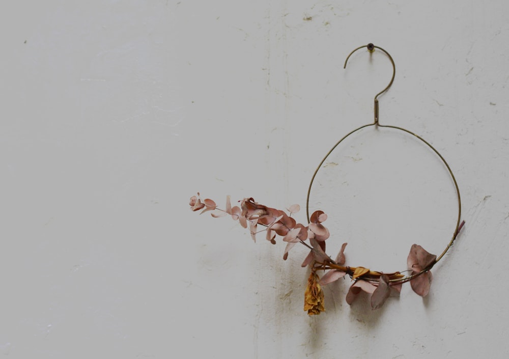 brown dried leaves on white wall