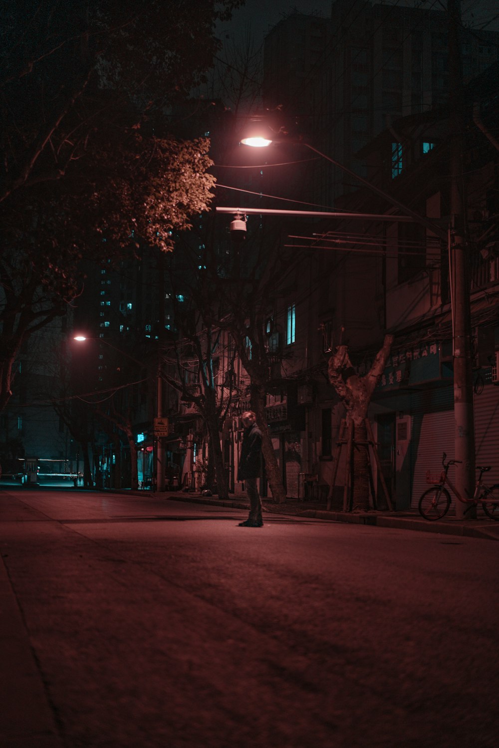 red and white street light turned on during night time