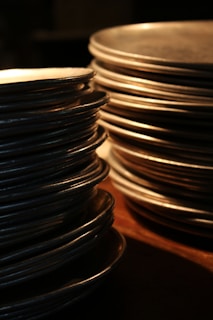 Sheets of stainless steel laid out flat, highlighting their polished finish and thickness.