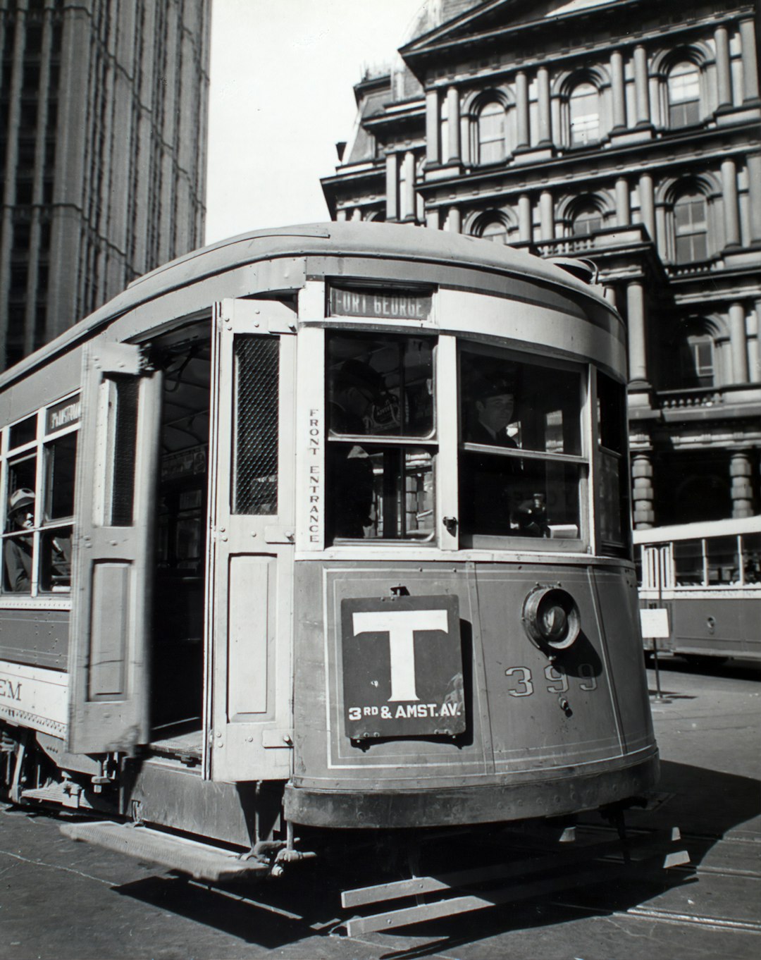 white and black photo of old post office trolley in the daytime