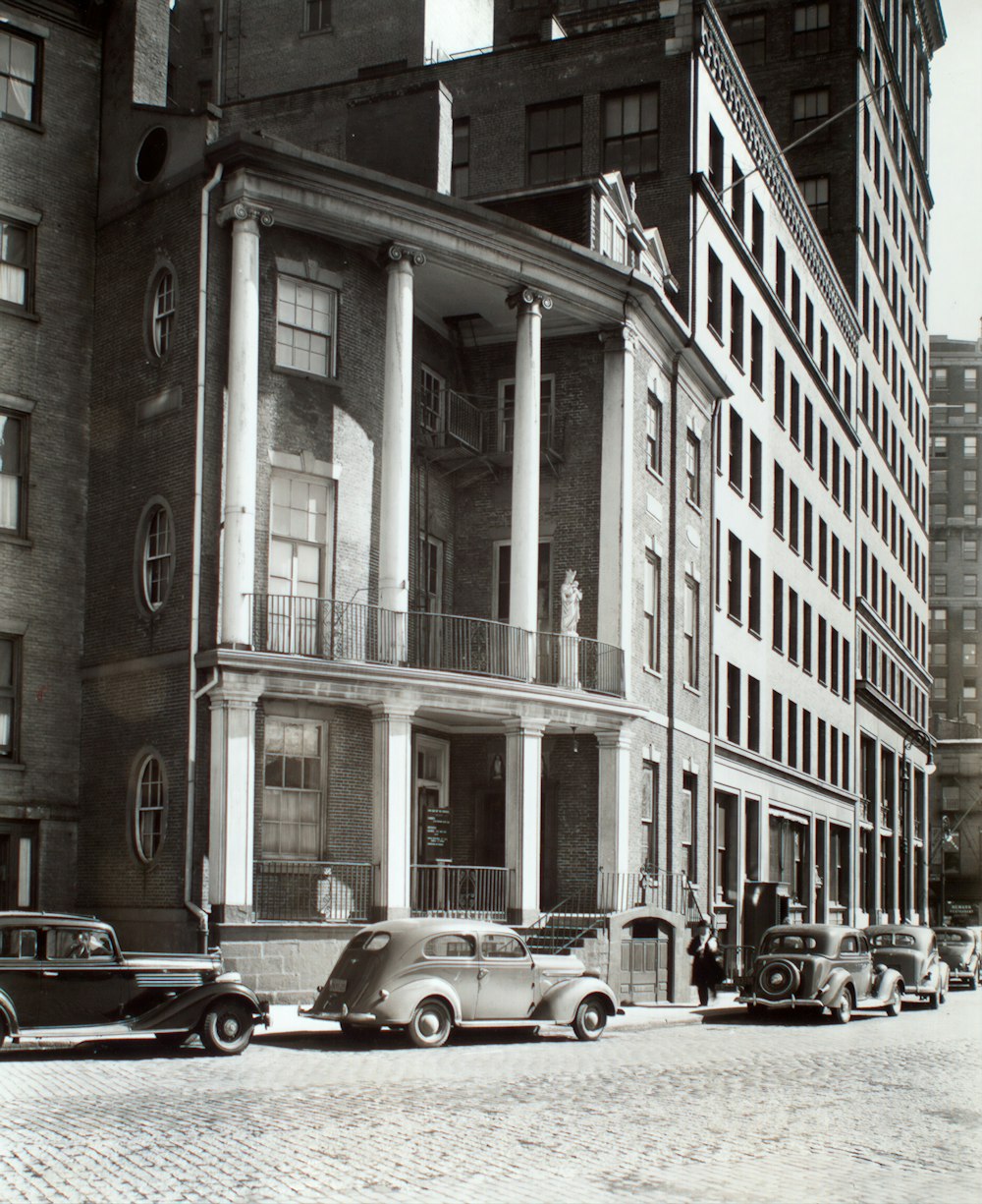 cars parked in front of building during daytime