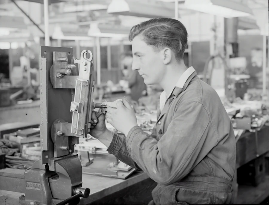Factory supervisor reviewing a production schedule on the floor