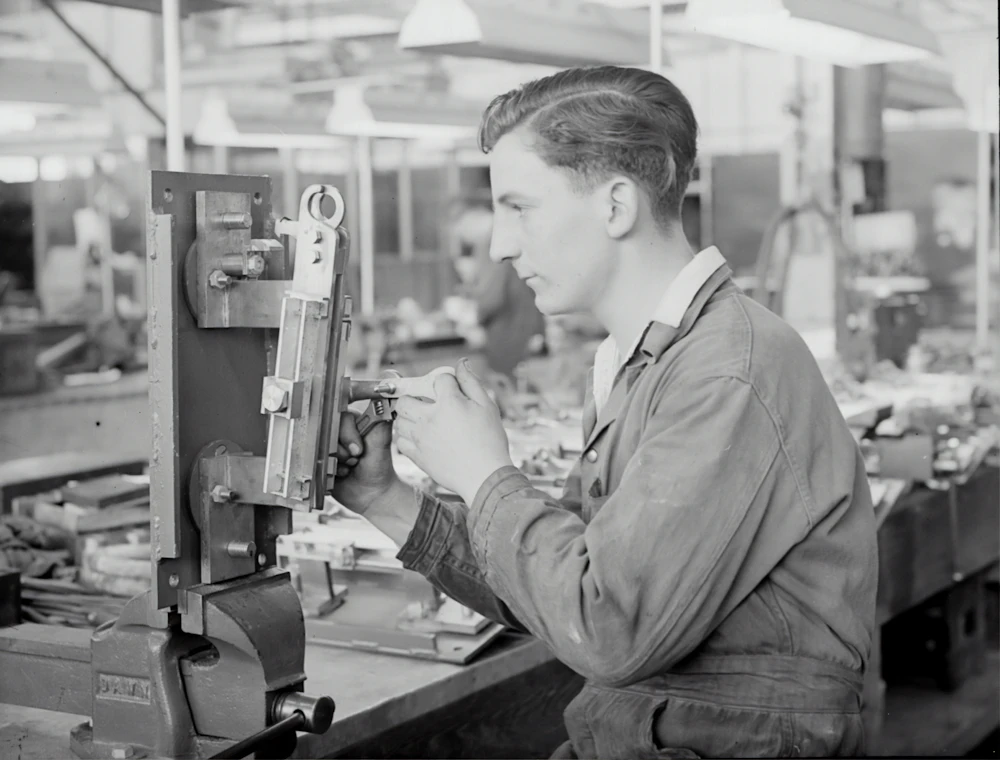Factory supervisor reviewing a production schedule on the floor