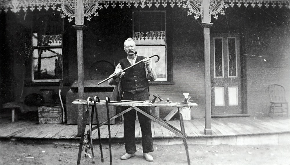 man playing trumpet in grayscale photography