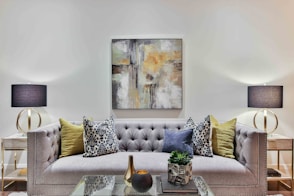 white and blue floral throw pillows on white couch