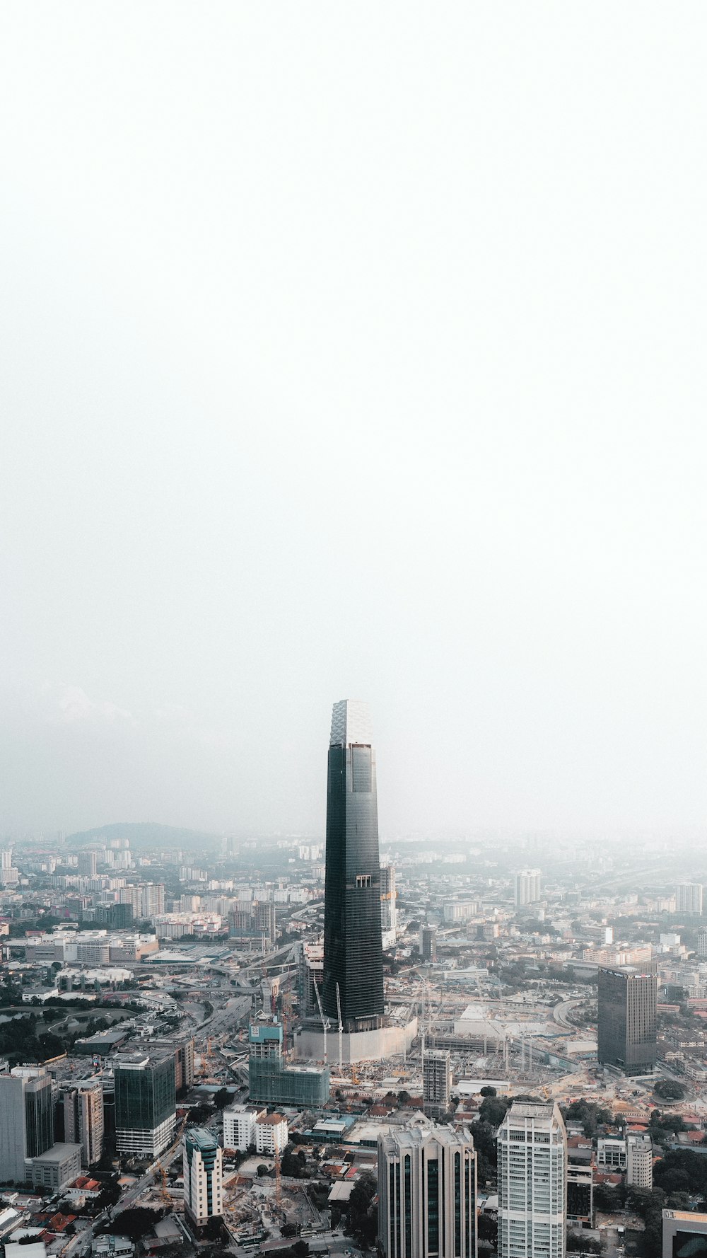 city buildings under gray sky during daytime