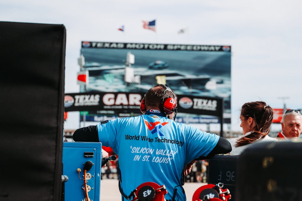 man in blue and red long sleeve shirt wearing black helmet