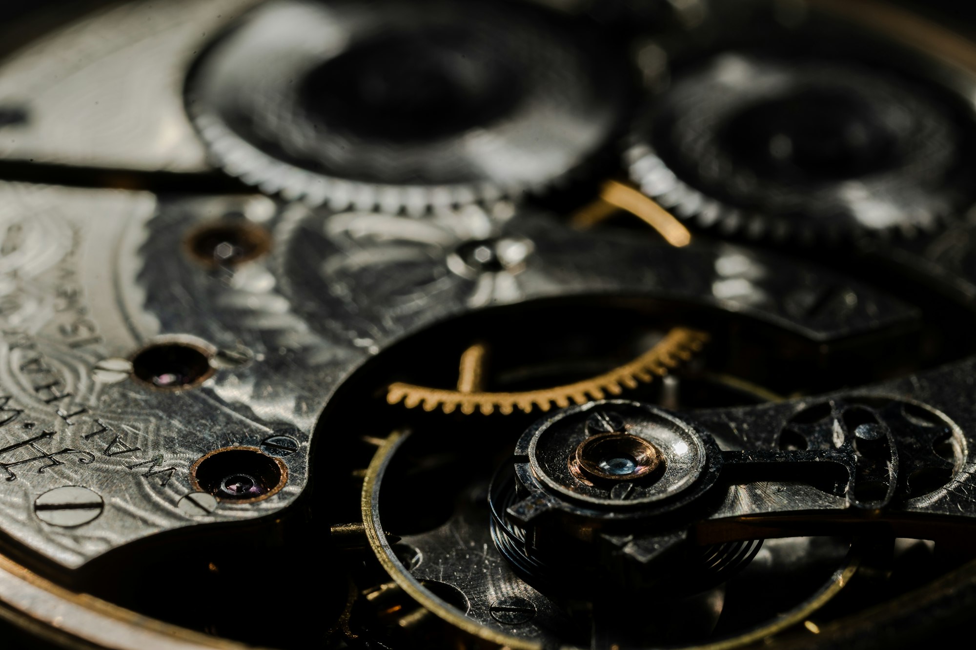 inside gears of an antique pocket watch