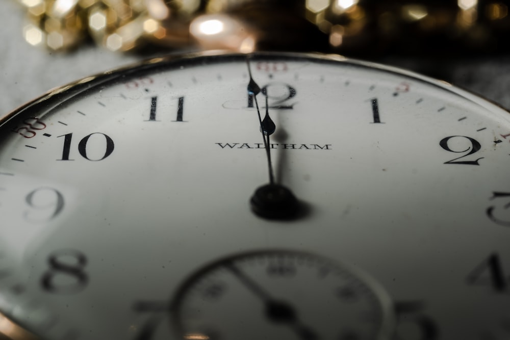 white and black analog clock