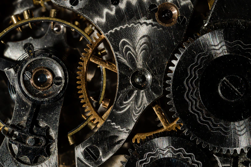 Metal gears and machinery symbolizing how parts of a business need to work together to succeed