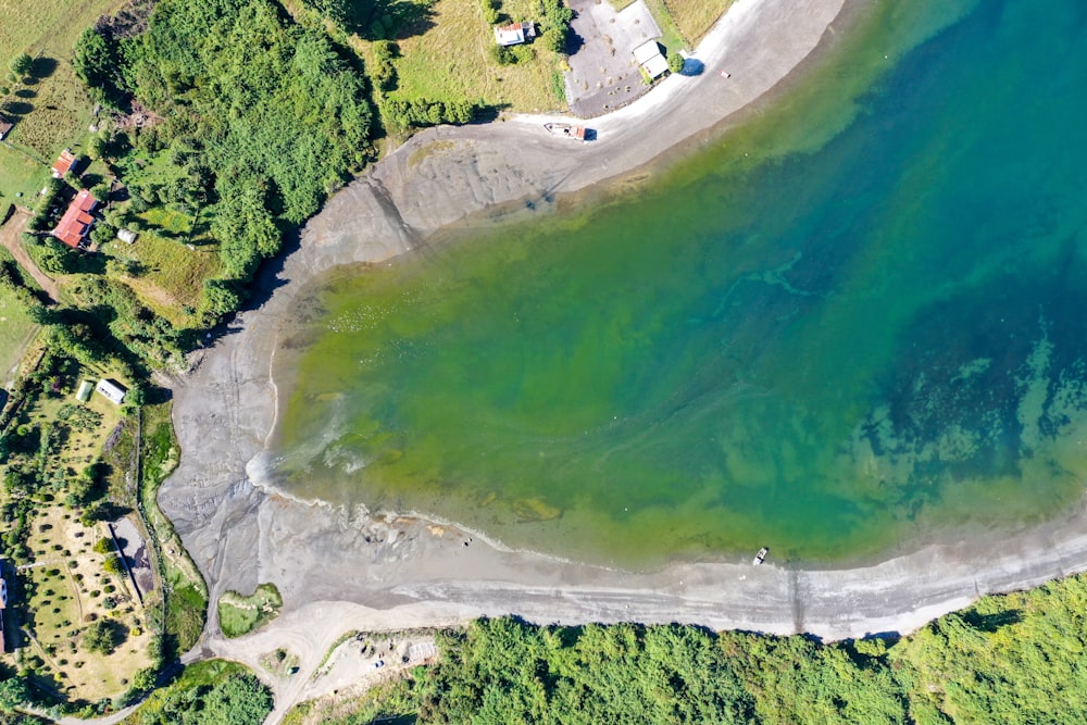 aerial view of green and white lake