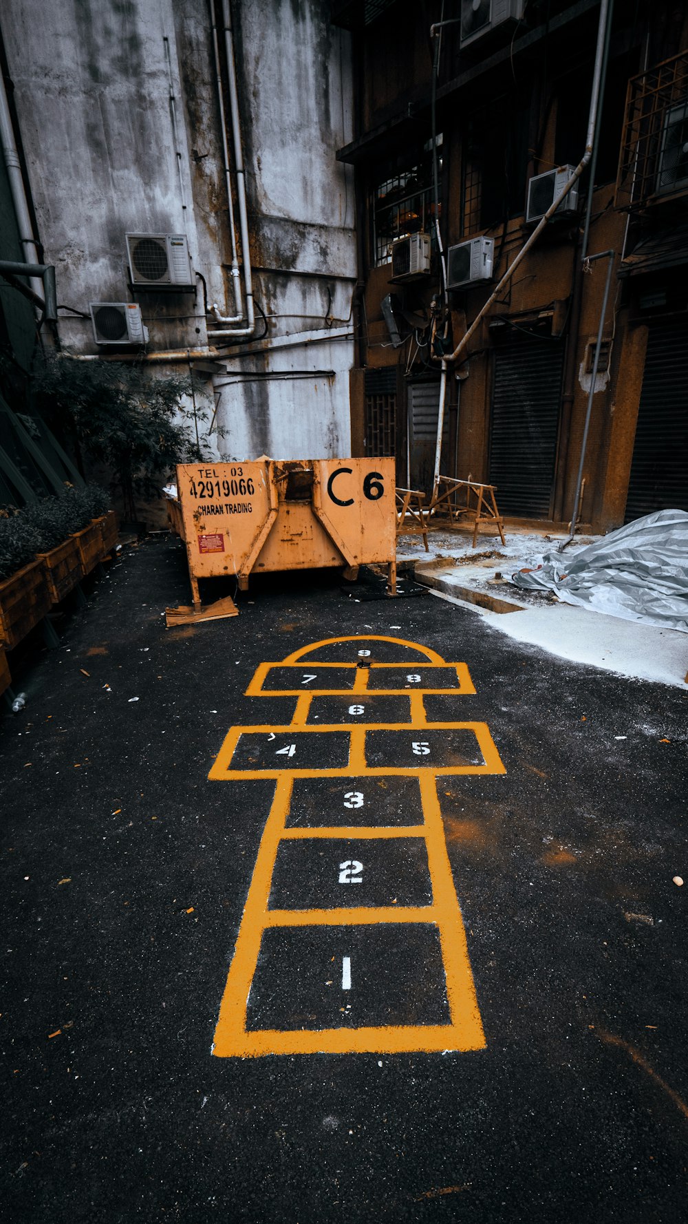 brown wooden boxes on gray concrete floor