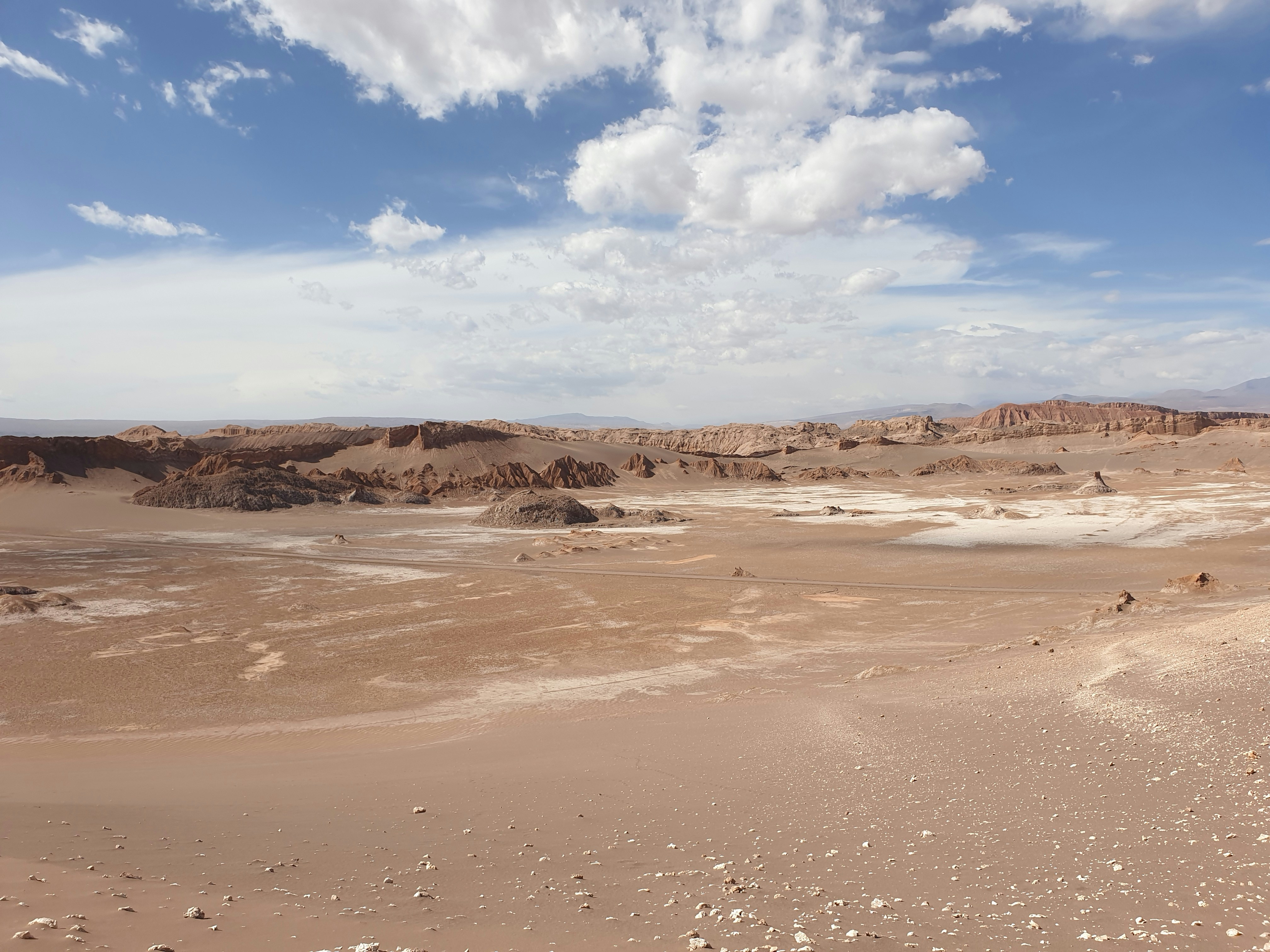 brown sand under blue sky and white clouds during daytime, 