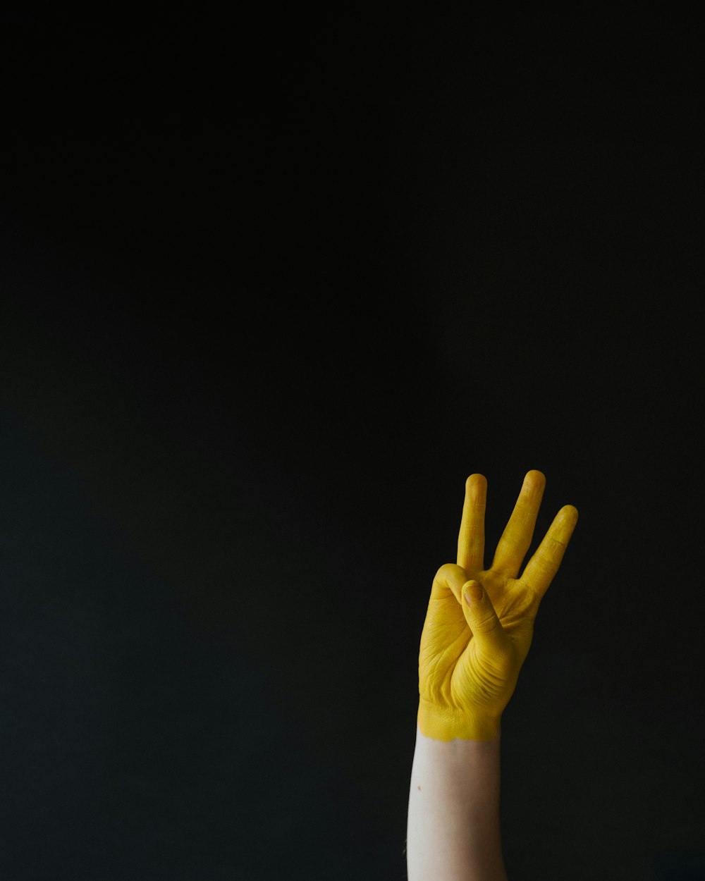 person in white long sleeve shirt showing right hand