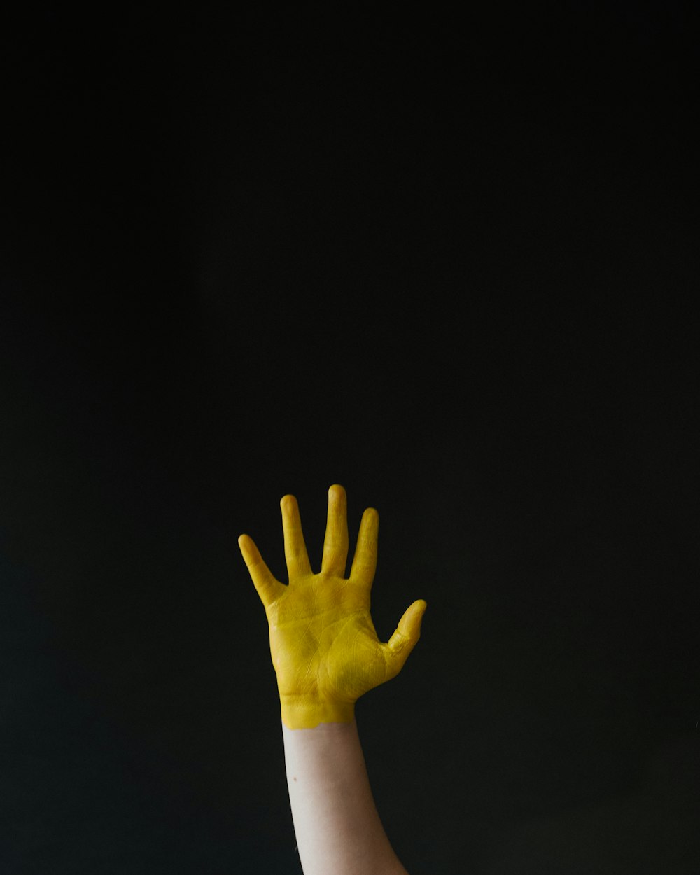 persons left hand with white long sleeve shirt