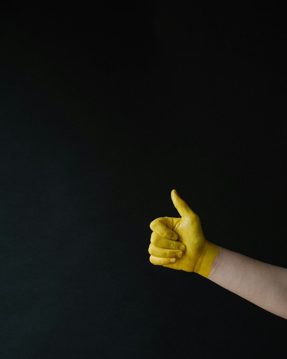 person doing thumbs up sign