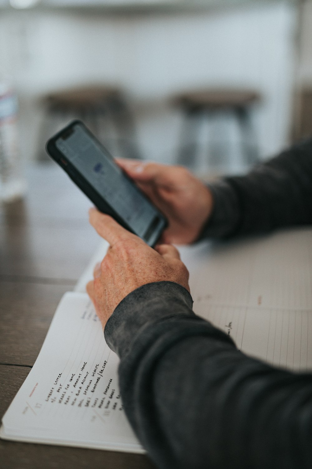 person holding black iphone 5