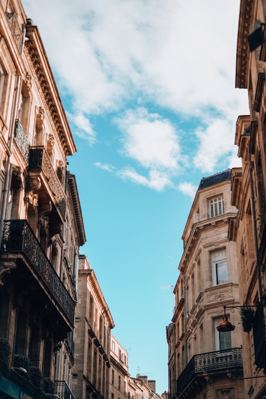 brown concrete building under blue sky during daytime in Bordeaux France