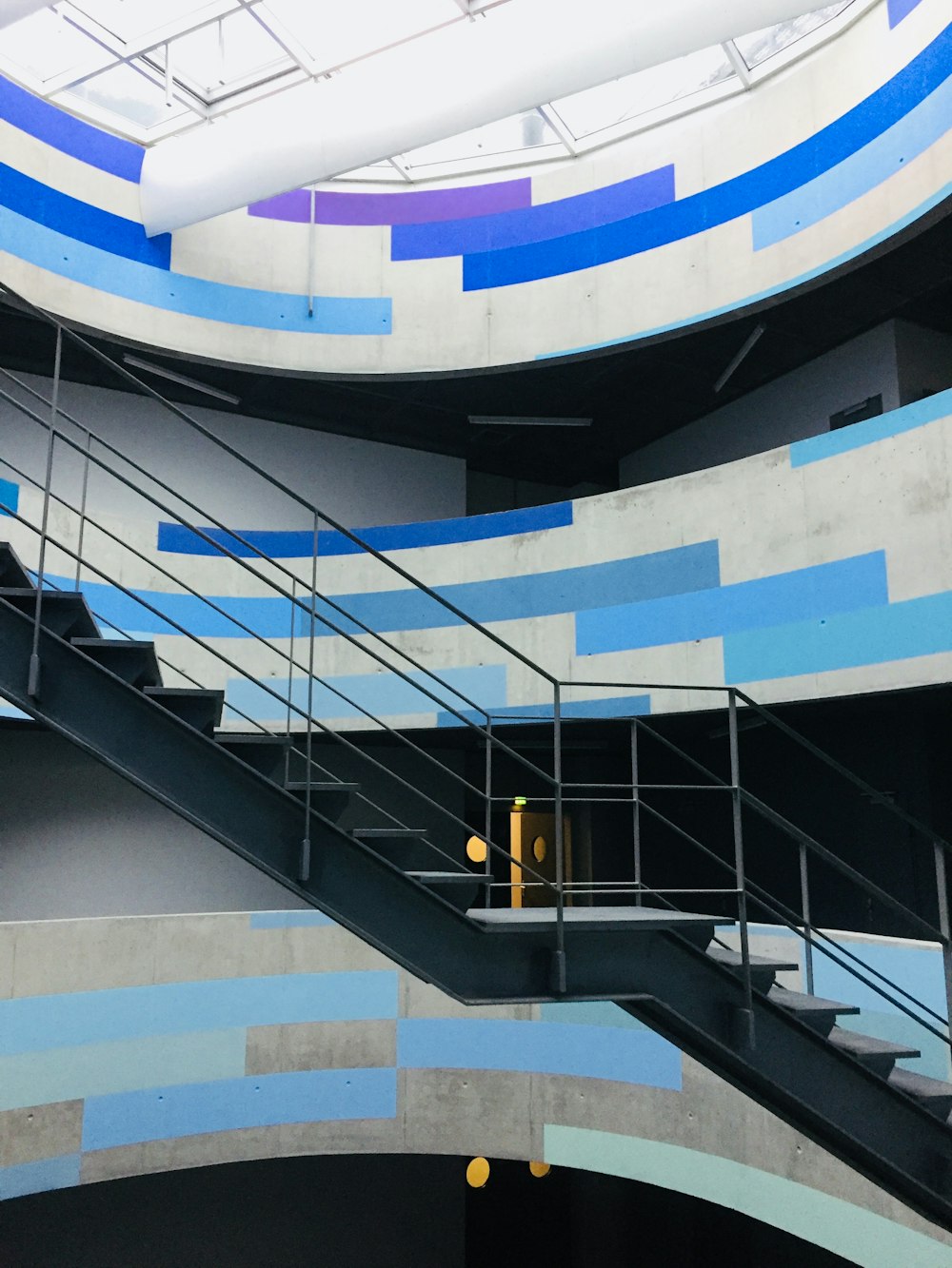 white and blue spiral staircase