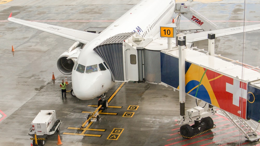 white airplane on airport during daytime