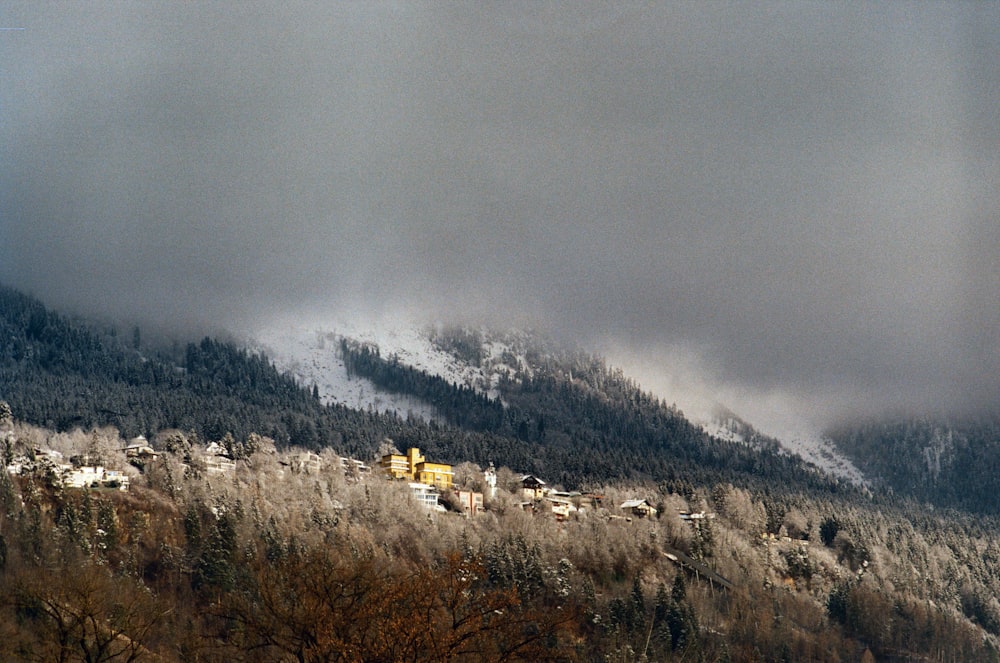 white and brown mountains under white clouds