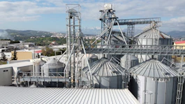 Industrial site with advanced chemical process systems under a clear sky.