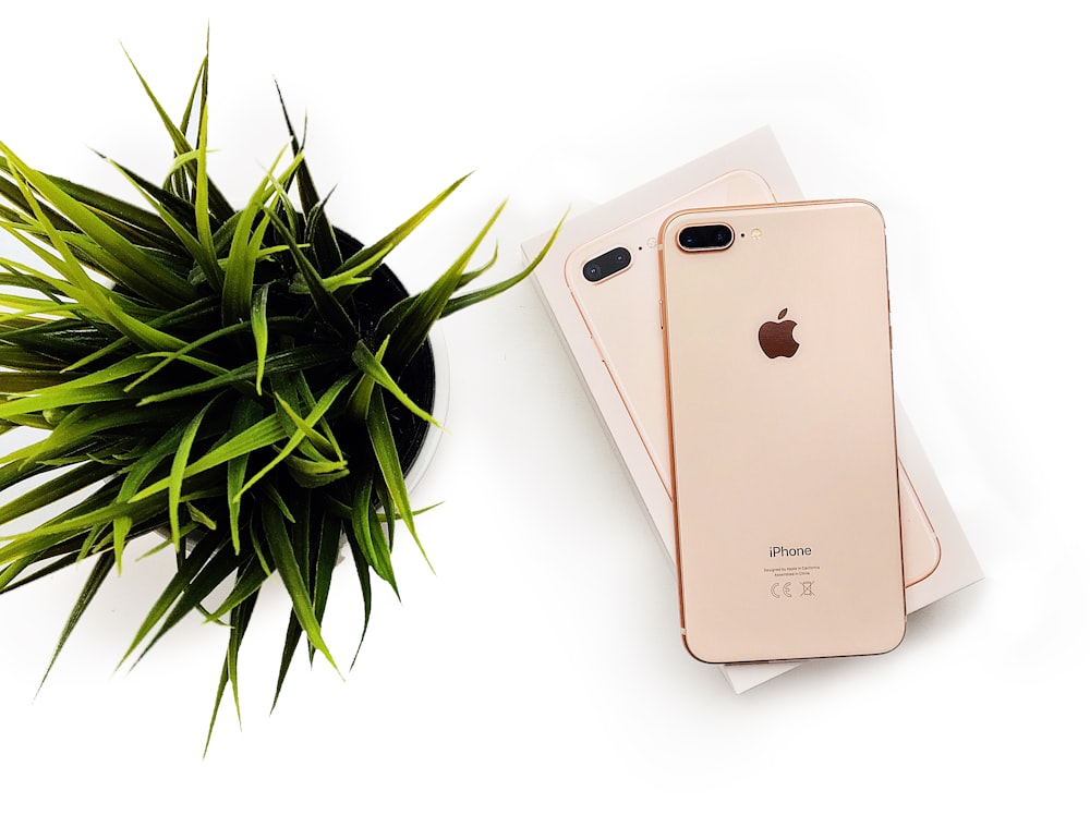 gold iphone 6 on white table
