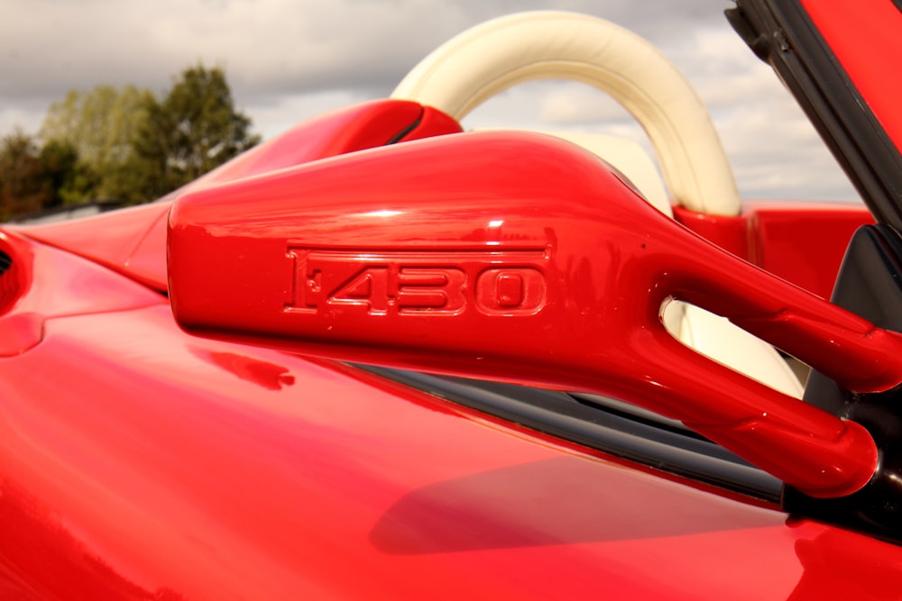 red and white car steering wheel