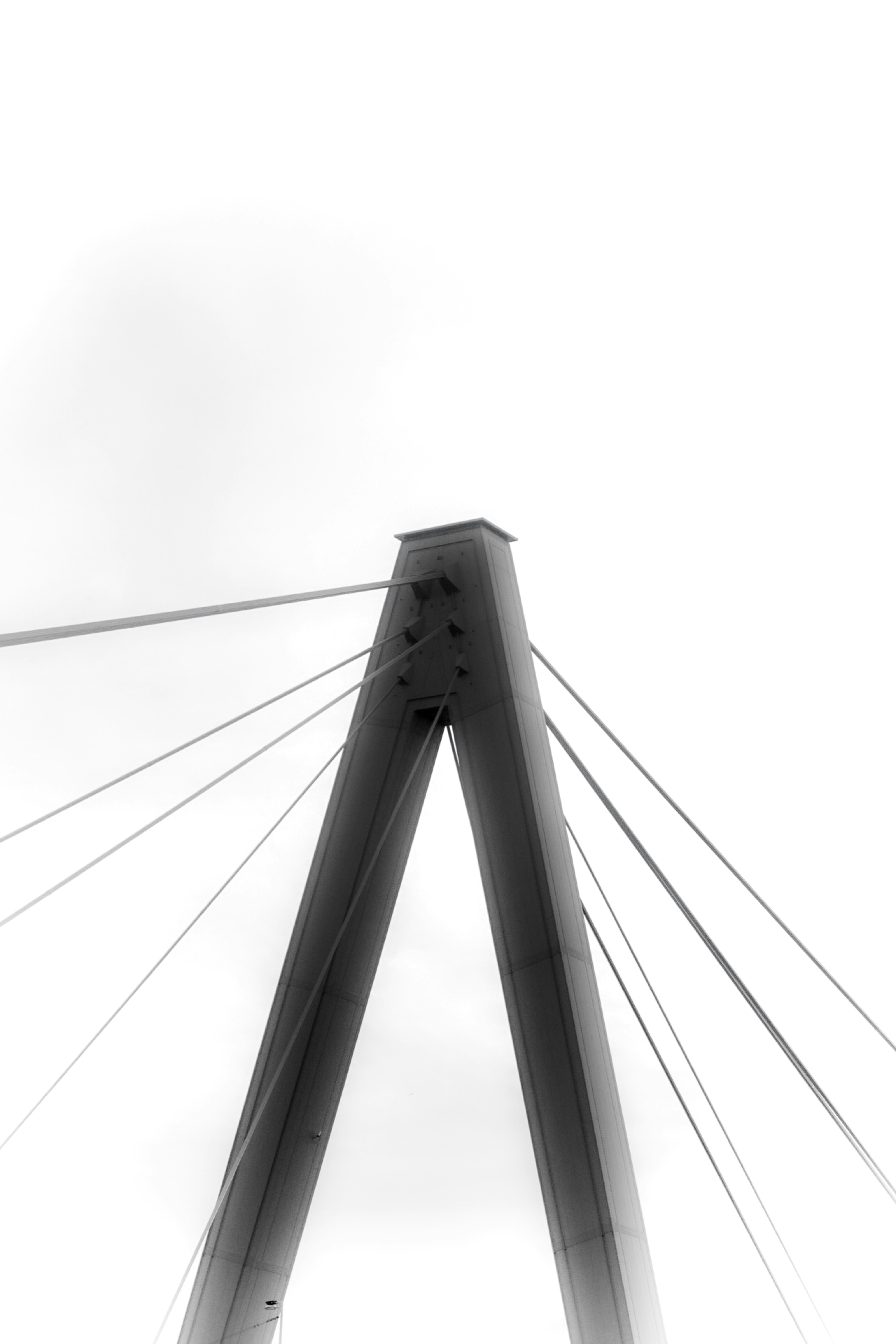 white and black bridge under white sky