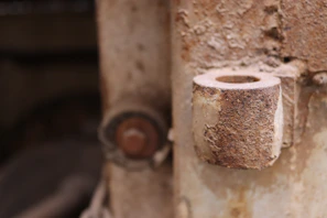 Close shot of rusty metal textures layered on old machinery parts