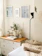 Cozy bedroom corner featuring a rich wooden dresser with natural grain and warm lighting.