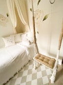 brown wooden bed frame with white bed linen