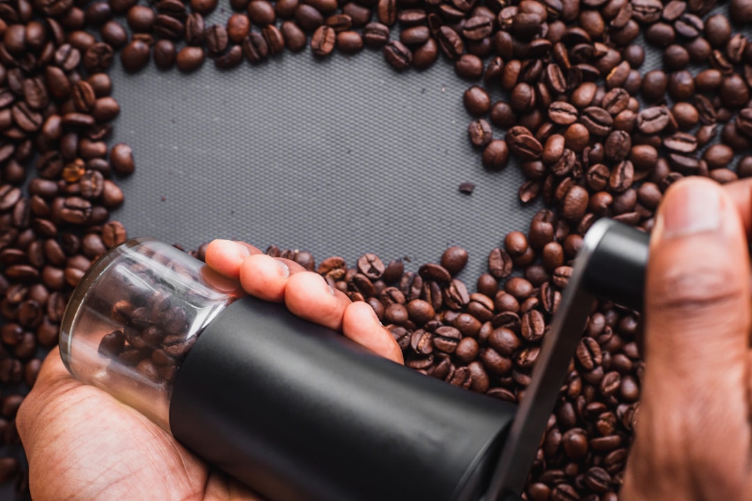 brown coffee beans on black bottle