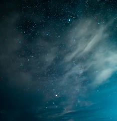 A serene blue nebula background with soft glowing stars.