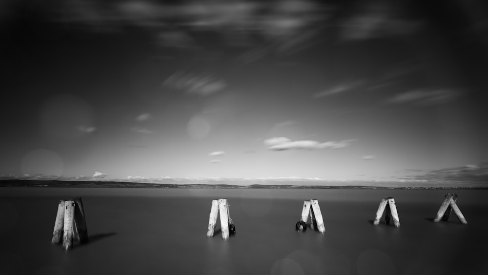 grayscale photo of people on beach