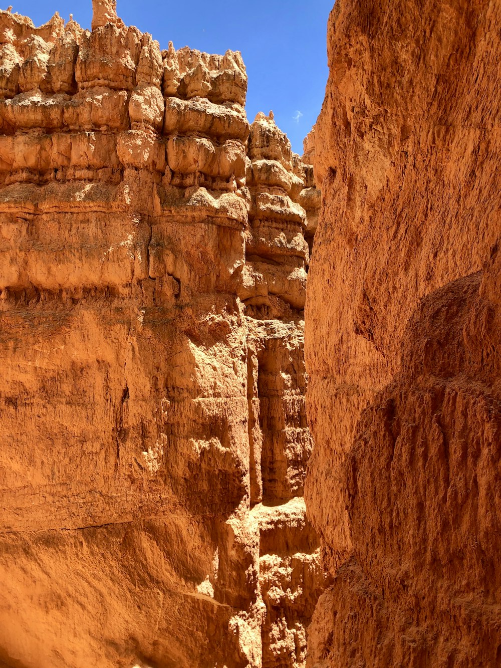 brown rock formation under blue sky during daytime