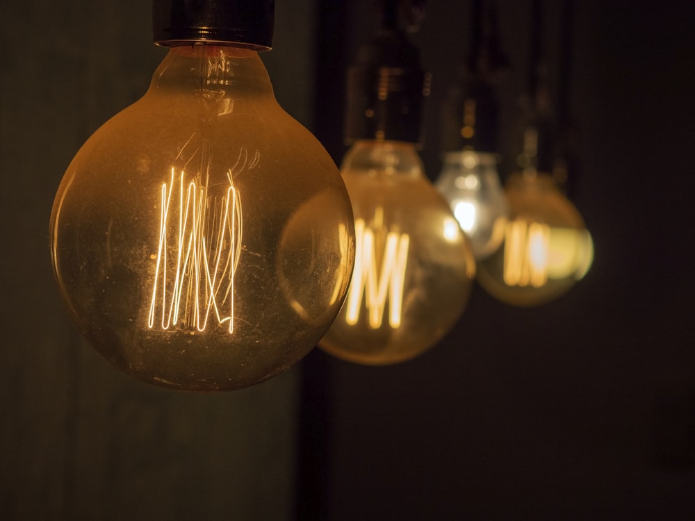 selective focus photography of light bulb