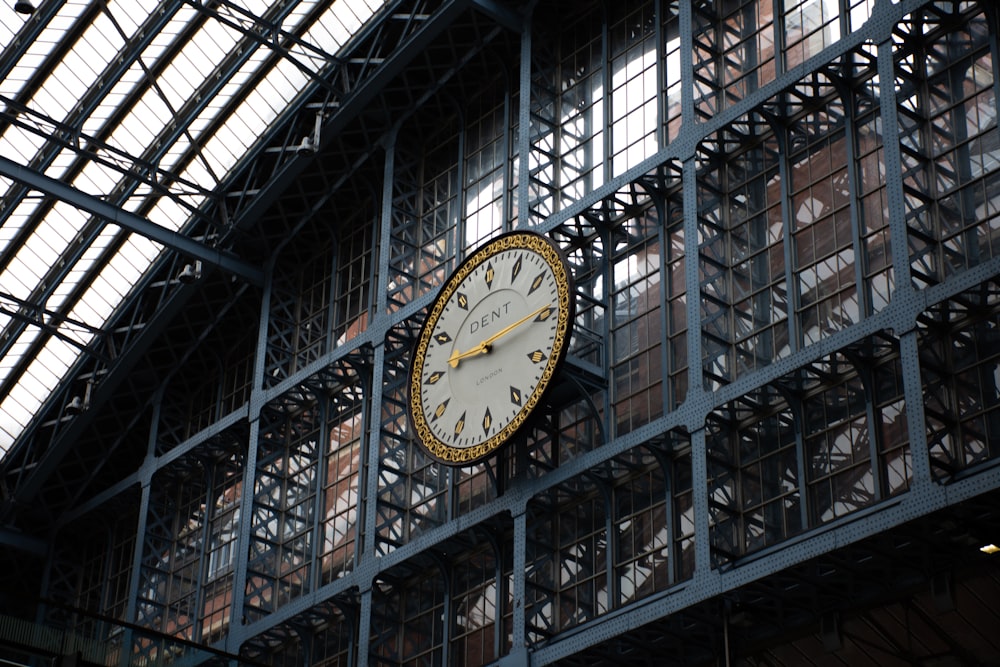 black and white analog clock at 10 00