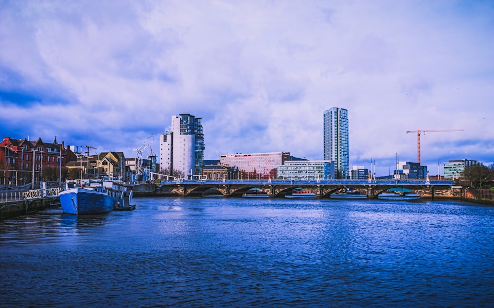 city skyline across body of water during daytime