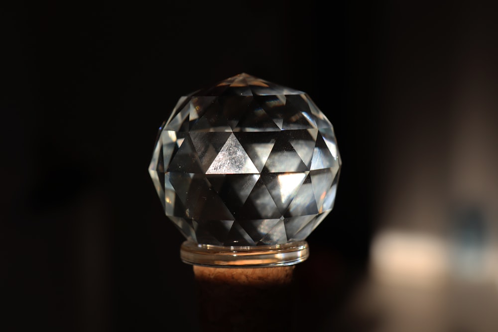silver diamond on brown wooden stand