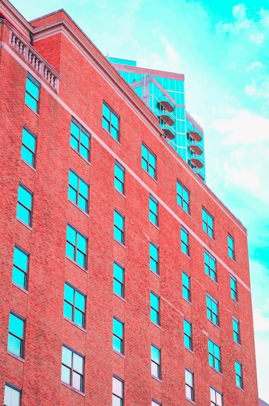 red concrete building under blue sky during daytime in Uptown United States