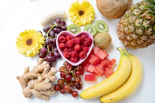 yellow banana fruit and red fruits