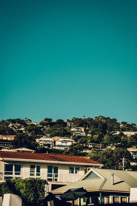 brown and white concrete house under blue sky during daytime in Safety Beach VIC Australia