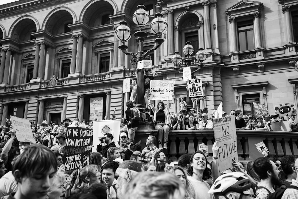 grayscale photo of people in street