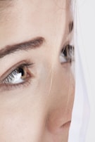 womans face with blue eyes