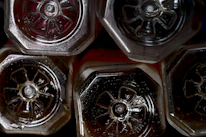 Close-up of HDPE and glass bottles used in chemical and pharmaceutical industries.