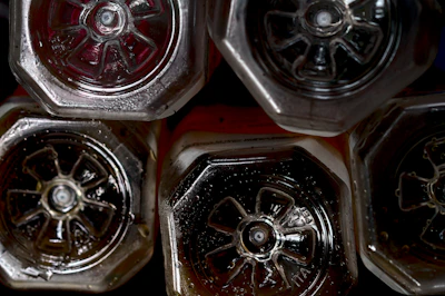 Close-up of HDPE and glass bottles used in chemical and pharmaceutical industries.