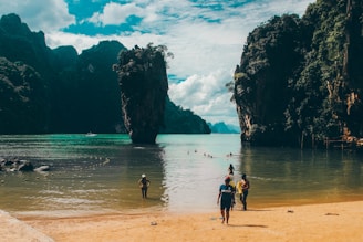 people walking on beach during daytime