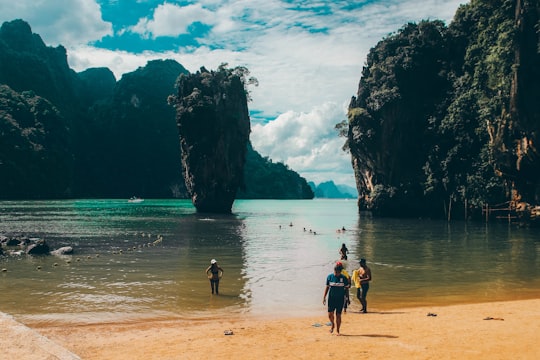 people walking on beach during daytime in Ko Tapu (James Bond Island) Thailand