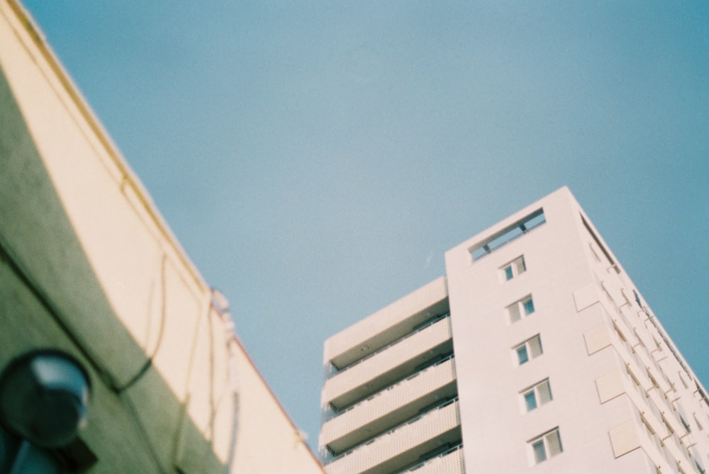 white concrete building under blue sky during daytime